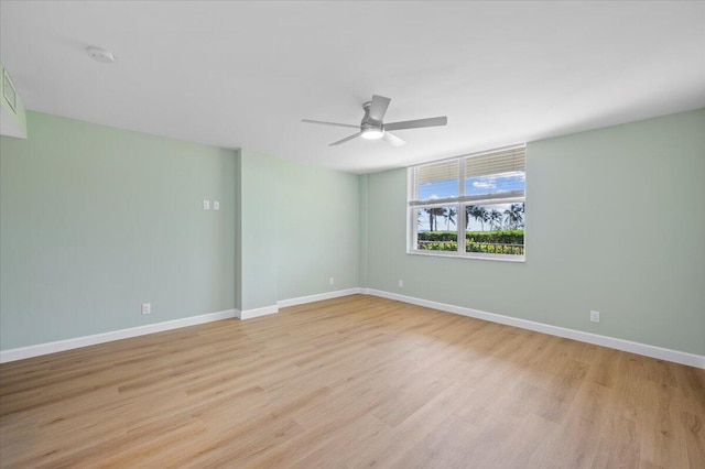 unfurnished room with ceiling fan and light hardwood / wood-style flooring