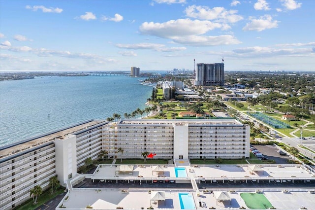 birds eye view of property with a water view