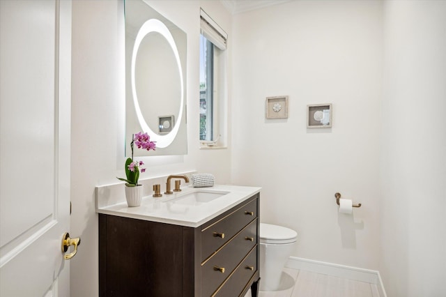 bathroom with tile patterned floors, vanity, and toilet