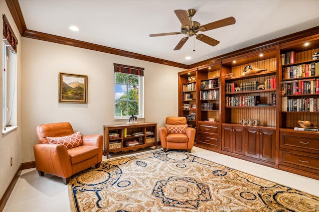 sitting room featuring ceiling fan and crown molding