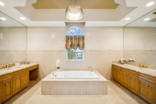 bathroom featuring tile patterned flooring, vanity, and tile walls