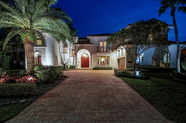 mediterranean / spanish-style house featuring a balcony