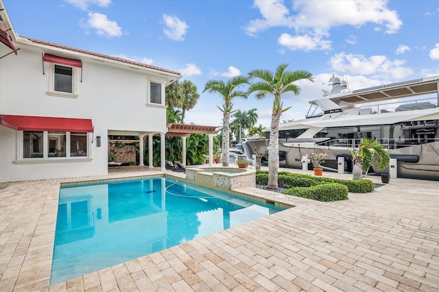 view of pool featuring a pergola, an in ground hot tub, and a patio