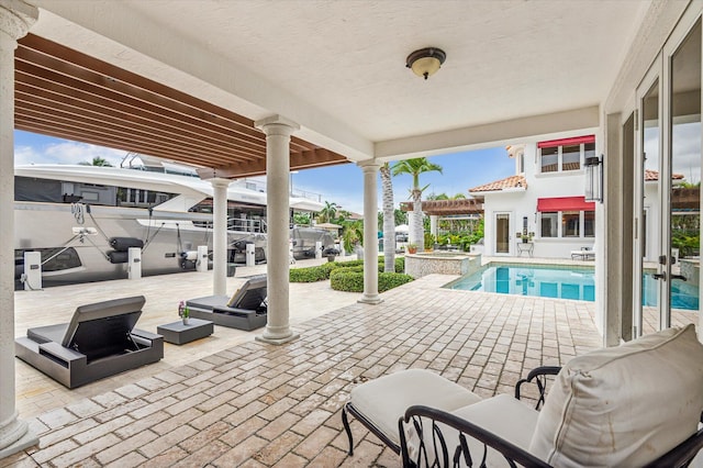 view of pool featuring a pergola, an in ground hot tub, and a patio