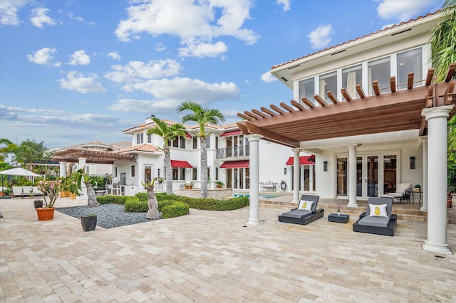 view of patio featuring a pergola, french doors, and a pool