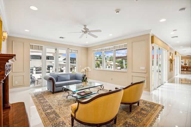 living room featuring ceiling fan, ornamental molding, and light tile patterned floors