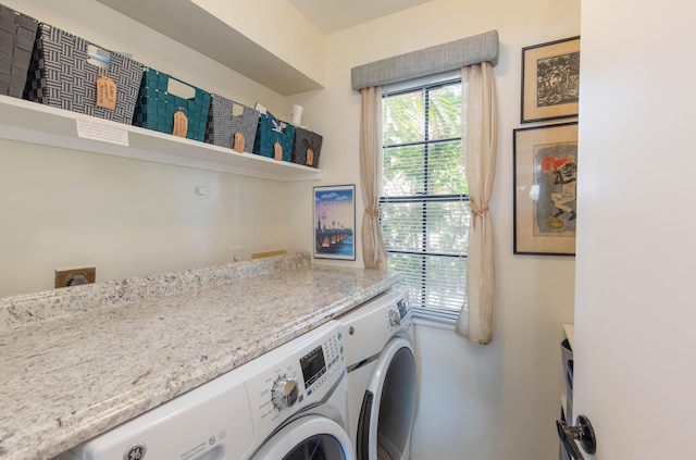 washroom with washing machine and dryer