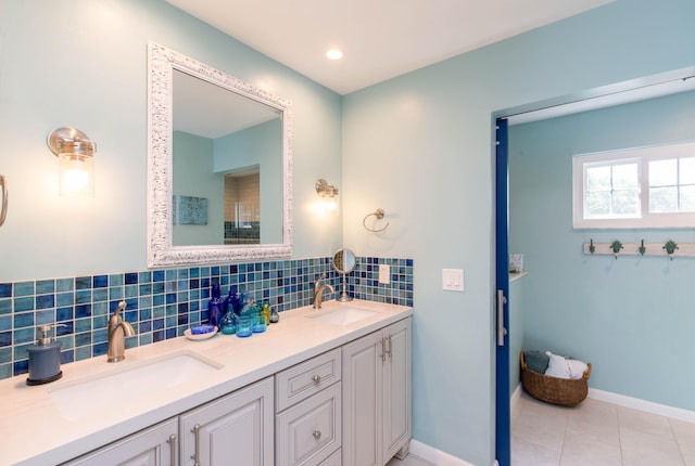 bathroom featuring vanity, decorative backsplash, and tile patterned floors