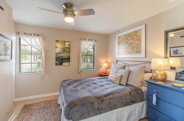 bedroom featuring wood-type flooring and ceiling fan