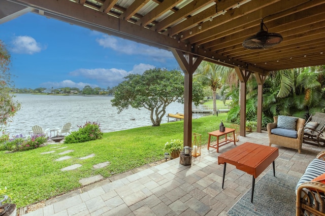 view of patio / terrace with a water view and ceiling fan