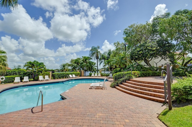 view of swimming pool with a patio