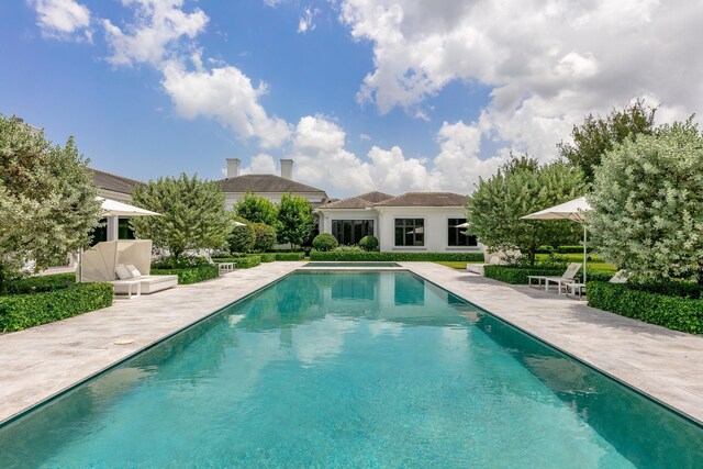 view of swimming pool with a patio