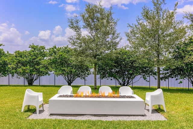 exterior space featuring a yard and a fire pit