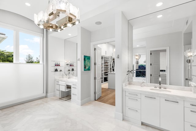 bathroom featuring vanity and an inviting chandelier