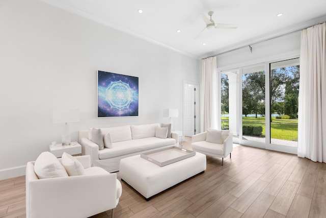 living room with ceiling fan and light wood-type flooring