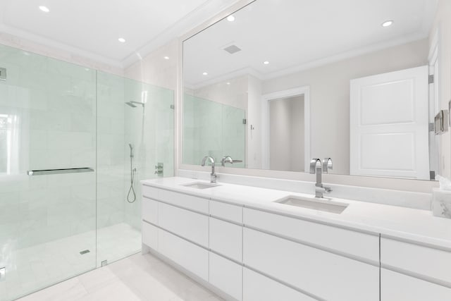 bathroom featuring ornamental molding, a shower with door, and vanity