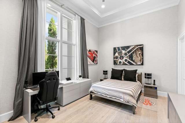 bedroom featuring crown molding and light wood-type flooring