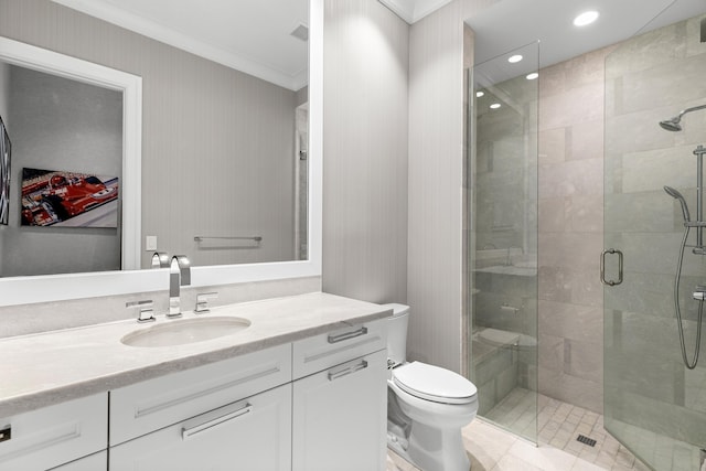 bathroom with an enclosed shower, vanity, crown molding, and toilet