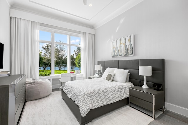 bedroom with ornamental molding and wood-type flooring