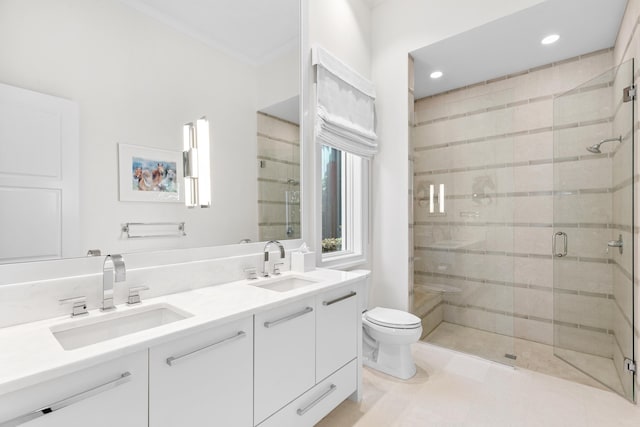 bathroom with walk in shower, vanity, and toilet