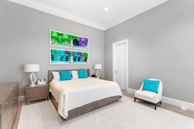 bedroom with crown molding and wood-type flooring