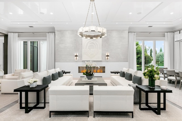 living room featuring coffered ceiling, crown molding, and a large fireplace