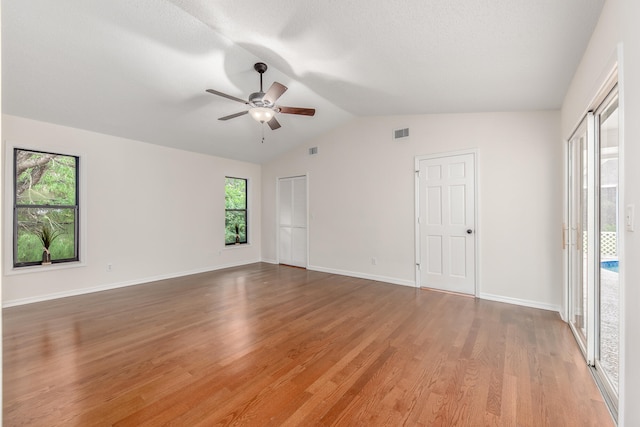 interior space featuring vaulted ceiling, hardwood / wood-style flooring, and ceiling fan