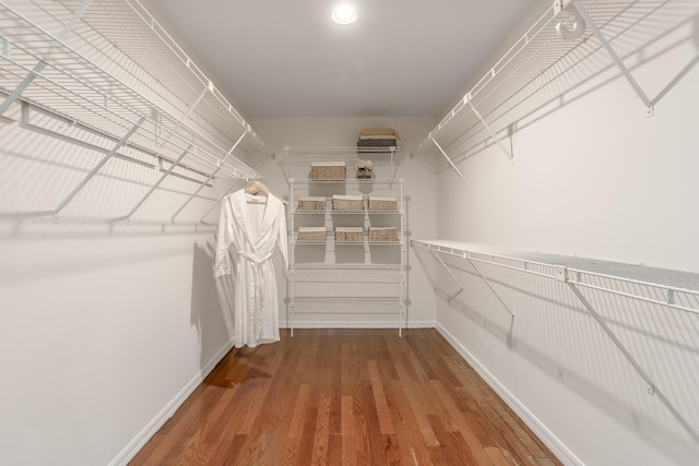 spacious closet featuring hardwood / wood-style floors