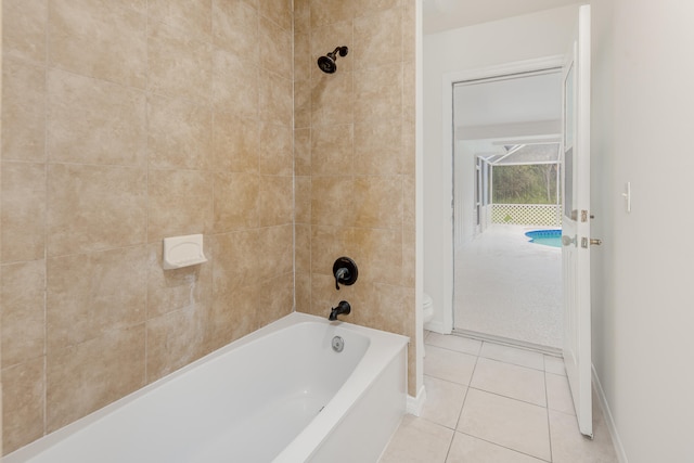 bathroom featuring tile patterned flooring and tiled shower / bath combo