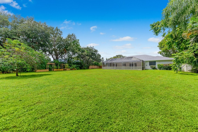 view of yard with a lanai