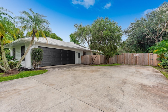 view of property exterior featuring a garage