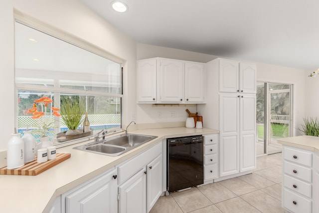 kitchen featuring black dishwasher, white cabinetry, and sink