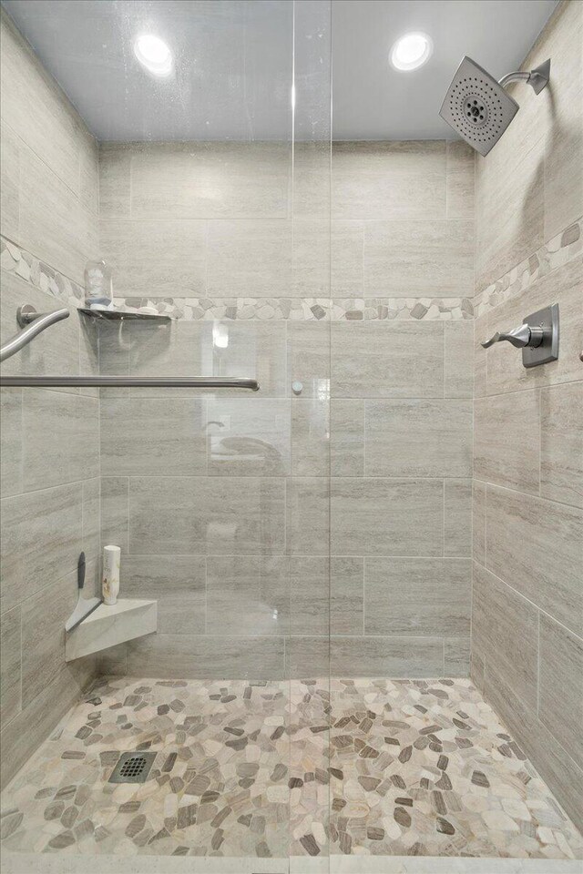 bathroom with tiled shower