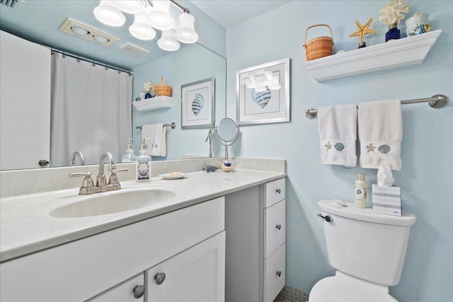 full bathroom with toilet and vanity