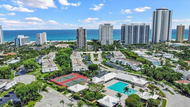 aerial view featuring a view of city and a water view