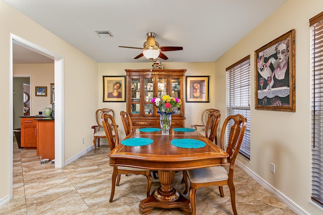 dining area featuring a wealth of natural light and ceiling fan