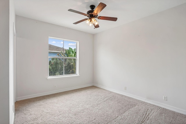 spare room with carpet flooring and ceiling fan