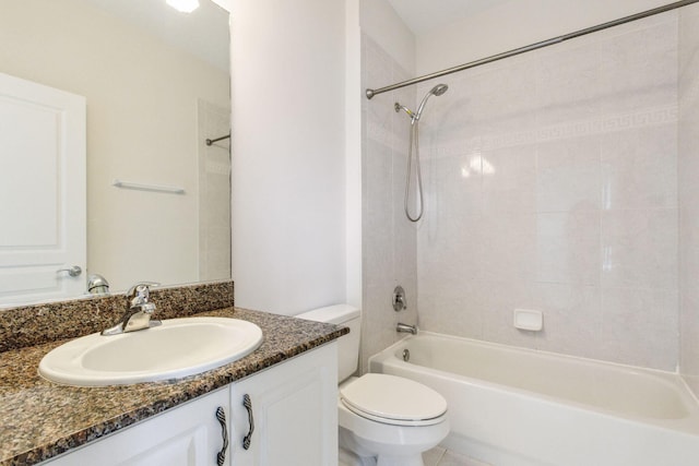 full bathroom featuring vanity, toilet, and tiled shower / bath combo