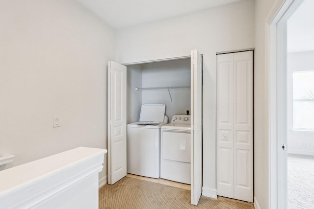 washroom featuring washer and dryer