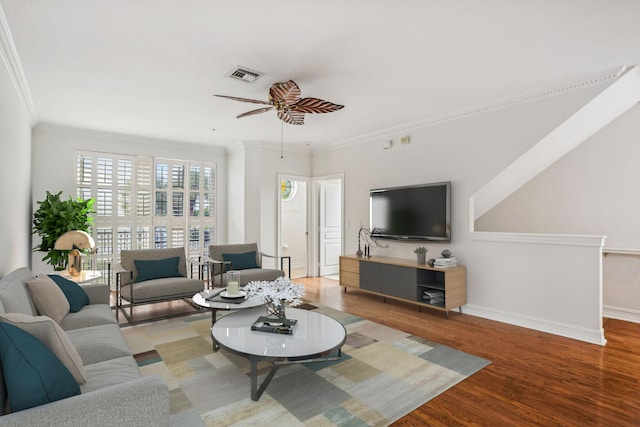 living room with ceiling fan, light hardwood / wood-style floors, and ornamental molding