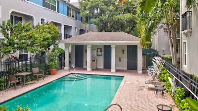 view of pool with an outdoor structure and a patio