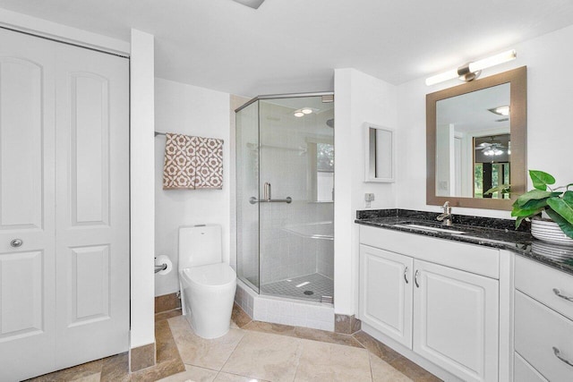 bathroom featuring walk in shower, vanity, and toilet