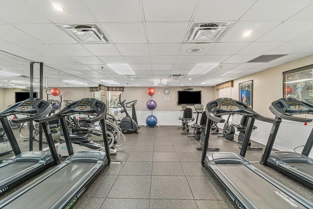 workout area featuring a paneled ceiling