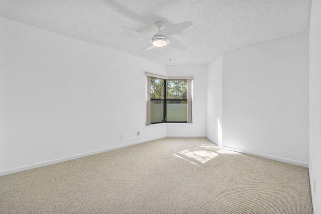 16769 Oak Hill Trl Unit 711, Delray Beach, FL 33484 - spare room featuring carpet floors, ceiling fan, baseboards, and a textured ceiling