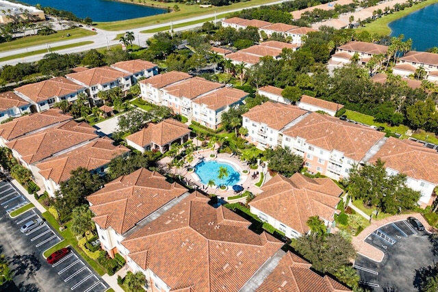 birds eye view of property with a water view