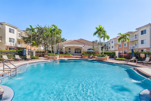 view of swimming pool featuring a patio and pool water feature