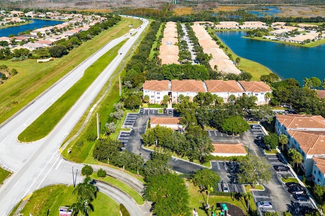 birds eye view of property with a water view