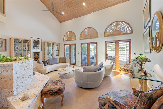 living room with french doors, wood ceiling, high vaulted ceiling, light hardwood / wood-style flooring, and ceiling fan