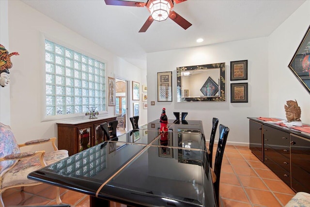 dining area featuring light tile patterned floors and ceiling fan