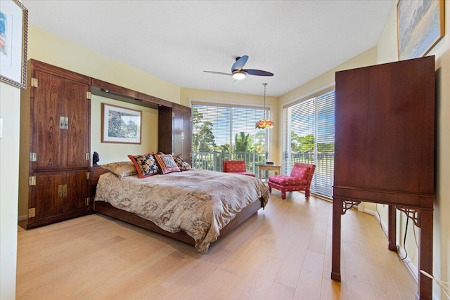 bedroom with ceiling fan and light wood-type flooring